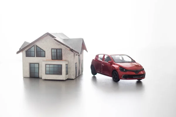 Home and car artificial on the concrete