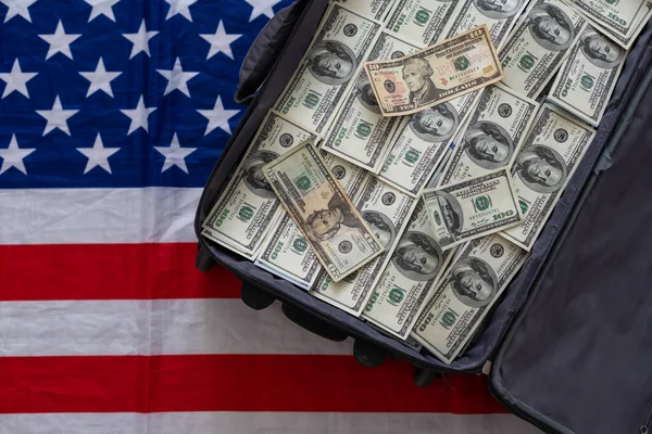 Open suitcase with one million dollars bills stacks. High quality photo