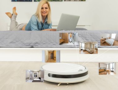 İnsanlar, ev işleri ve teknoloji konsepti. Robot elektrik süpürgesi