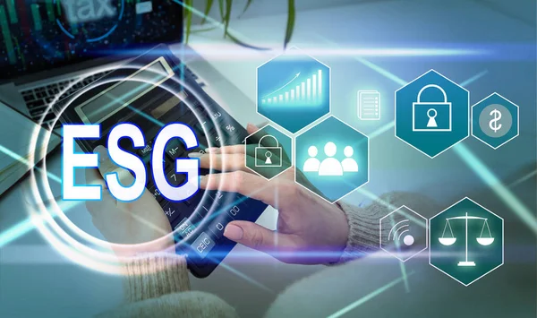 ESG environmental social governance investment business concept. analyze ESG data. icons pop up on virtual screen in business sustainability investment strategy concept.