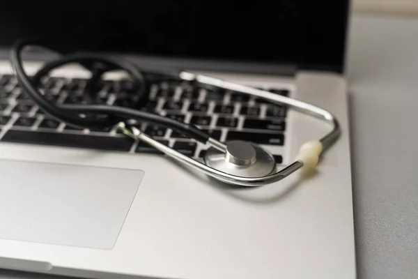 Stethoscope on a computer keyboard.