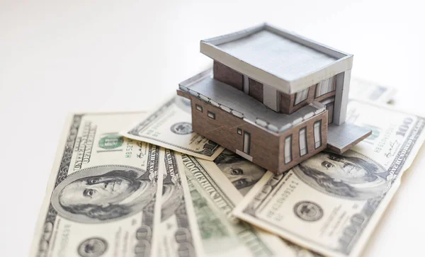 stock image Miniature paper house with money.