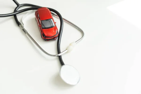 stock image Toy car and stethoscope on white background. High quality photo