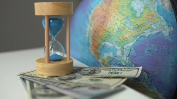 Wooden Egg Timer Alongside World Globe Earth Concept Running Out — Stock Video