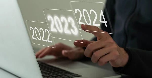 economic recovery after falling due to inflation, stagnation, recession, 2024 financial chart. Businessman pointing graph of future growth on virtual screen.