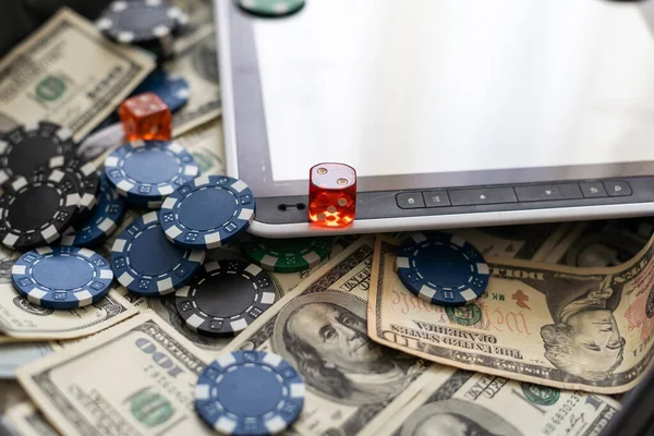 Sports betting concept on tablet screen with office objects on wooden desk. . High quality photo