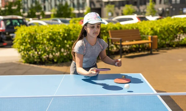 Young Teenager Girl Playing Ping Pong She Holds Ball Racket — Zdjęcie stockowe