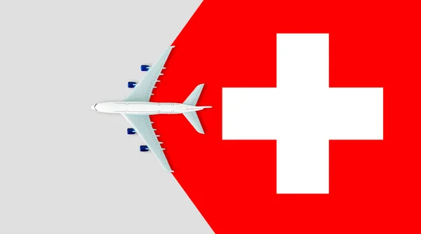 飞机上的瑞士国旗 旅程的概念 以国旗上的玩具飞机为背景 — 图库照片