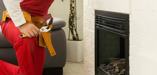 Man Screwdriver Installing Electric Fireplace Wall Room — 图库照片