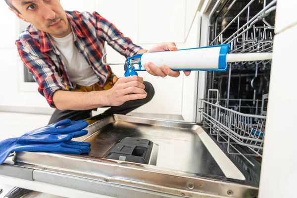 Worker Using Screwdriver Repair Dishwasher Home Stock Photo High Quality — Stock Photo, Image