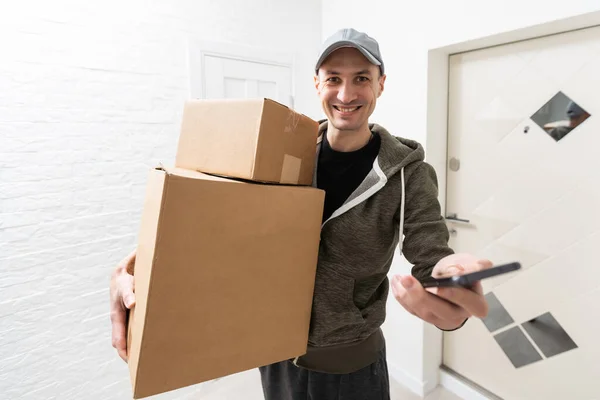 Full Length Portrait Smiling Delivery Man Package Clipboard White Background — Stock Photo, Image