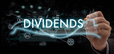DIVIDENDS concept presented by businessman touching on virtual screen ,image element furnished by NASA. High quality photo clipart