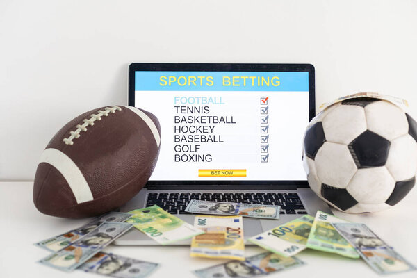betting bet sport phone gamble laptop over shoulder soccer live home website concept - stock image. High quality photo