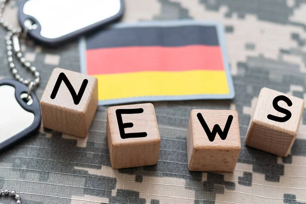 concept news feeds - Breaking news, Germany countrys flag, blackboard and the text News on wooden background. High quality photo