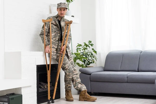 military Wounded Soldier Using Crutch.