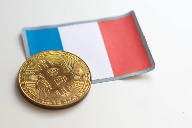 golden bitcoin metallic coin over euro banknotes with france flag. High quality photo clipart