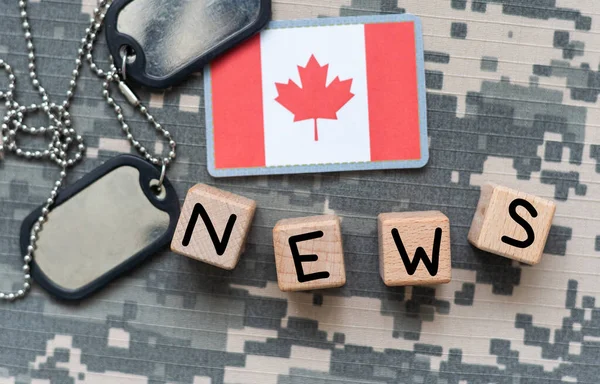 concept news feeds - Latest news, Canadian countrys flag, blackboard with text Breaking News on wooden background. High quality photo