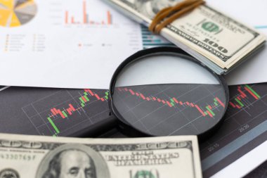 Üst ve düz iş grafikleri üzerinde büyüteç döşeme, tablo .business office toplantı konsepti. Yüksek kalite fotoğraf