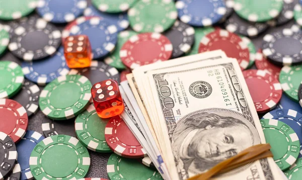 Cash money dollar bills and casino chips. Gambling casino chips and casino tokens.