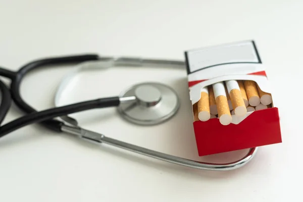 Cigarettes First Aid Tin Stethoscope White Background High Quality Photo — Stock Photo, Image