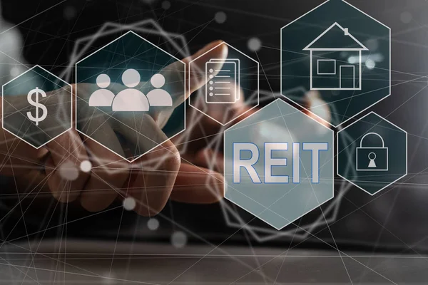 stock image REIT, Real Estate Investment Trust concept, Person hand using smart phone with Real Estate Investment Trust icon on virtual screen