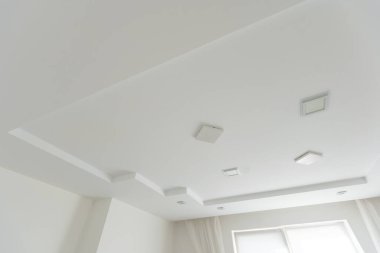 Stretched white matte ceiling in the room close-up. High quality photo clipart