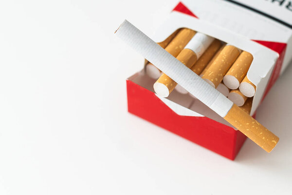 Open pack of cigarettes on a white background. High quality photo