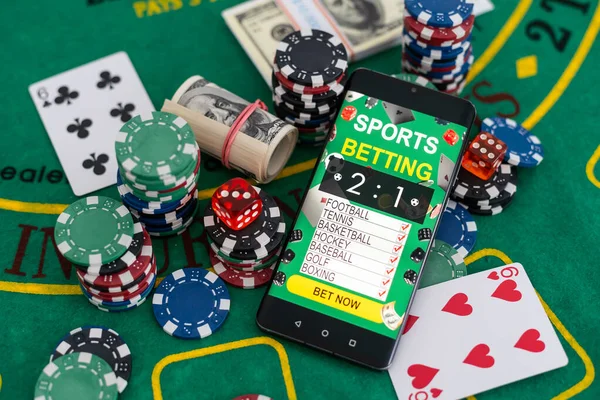 Online Poker casino banner with a mobile phone, chips, playing cards and dice. Marketing Luxury Banner Jackpot Online Casino. High quality photo