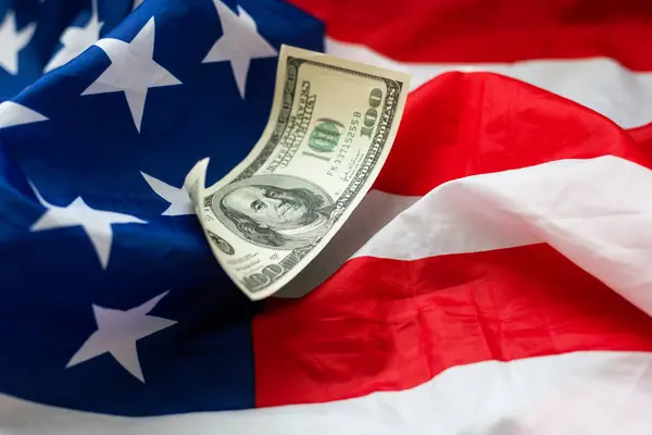 Dollar cash money on american flag. High quality photo