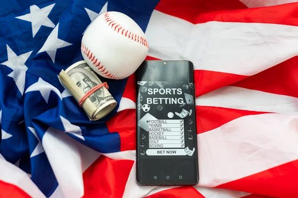 betting on sports, smart phone with working online betting mobile application. High quality photo