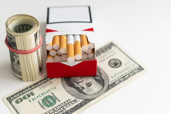 dollar bills and cigarette stack. High quality photo