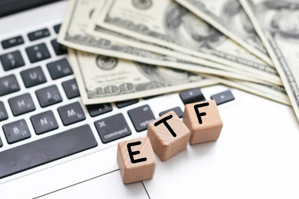 ETF Exchange-traded fund on wooden letters. High quality photo