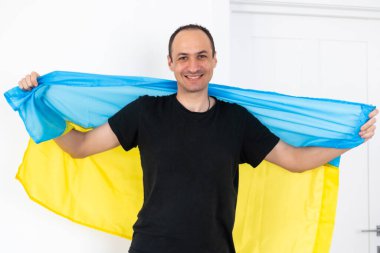 Portrait of a middle aged man with flag of Ukraine. High quality photo