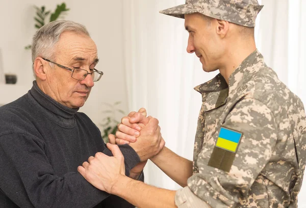 Ukrainian military man with his father.