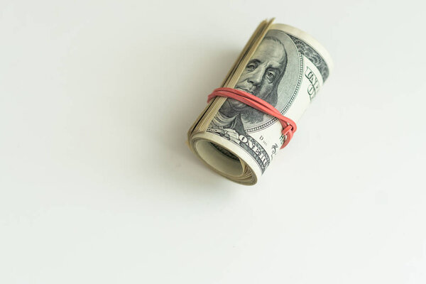 A close up of a stack of USA 1 dollar isolated on light background. High quality photo