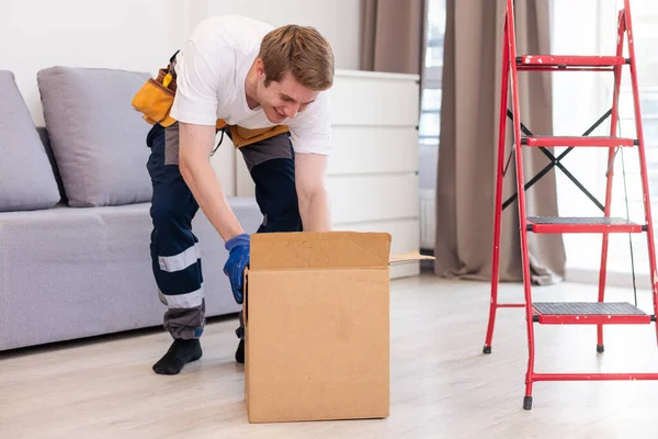 Young Happy Delivery Man Unloading Boxes — Stock Photo, Image