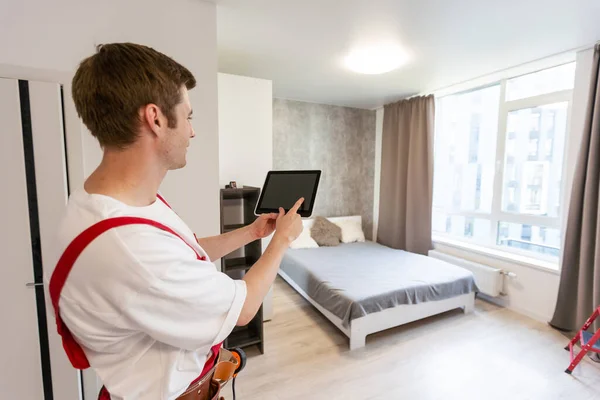 Worker Tablet Computer Checking Alarm System Indoors — Stock Photo, Image