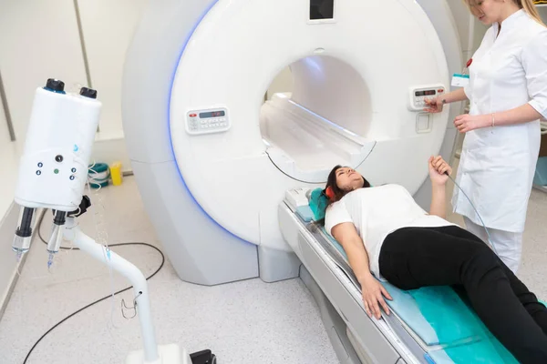 Medical CT or MRI Scan with a patient in the modern hospital laboratory. Interior of radiography department. Technologically advanced equipment in white room. Magnetic resonance diagnostics machine.