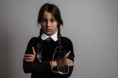 Wednesday student girl with a stethoscope.