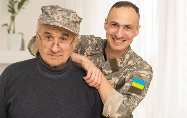 Ukrainian military man with his father.