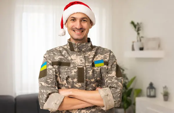 Ukrainian military man with a Santa hat.