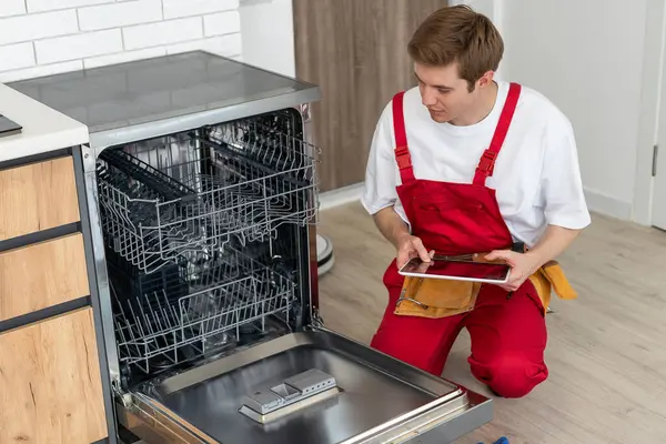 Master of Maintenance: Young Man Providing Home Appliance Repair Services.