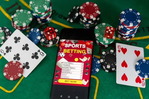 online casino concept, playing cards, dice chips and smartphone with copyspace on the green table. view from above. banner template layout mockup for online casinos and gambling. High quality photo
