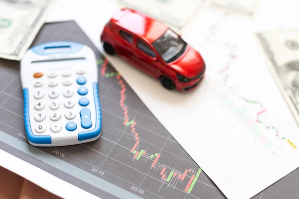 Toy car, money, documents and calculator on table. Car insurance concept. High quality photo