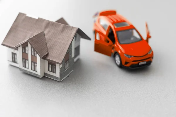 Car and House model with agent and customer discussing for contract to buy, get insurance or loan real estate or property background. High quality photo