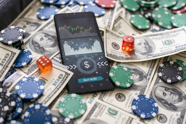 Online poker concept. Smartphone and poker chips on a green background. Poker online banner. Copy space. Vignette. Place for text. Gambling. Background. High quality photo