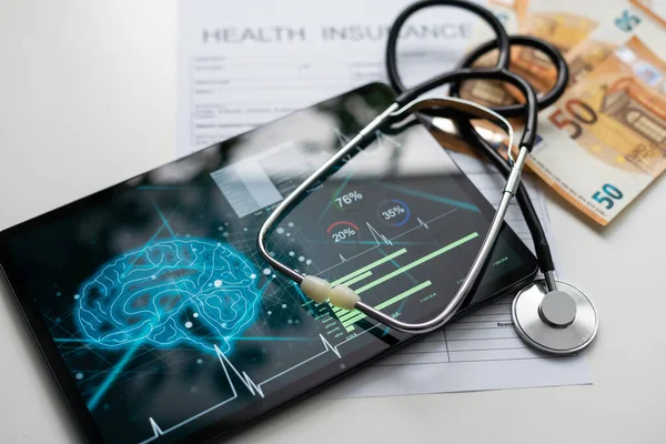 Health insurance, health conceptual, tablet, stethoscope.