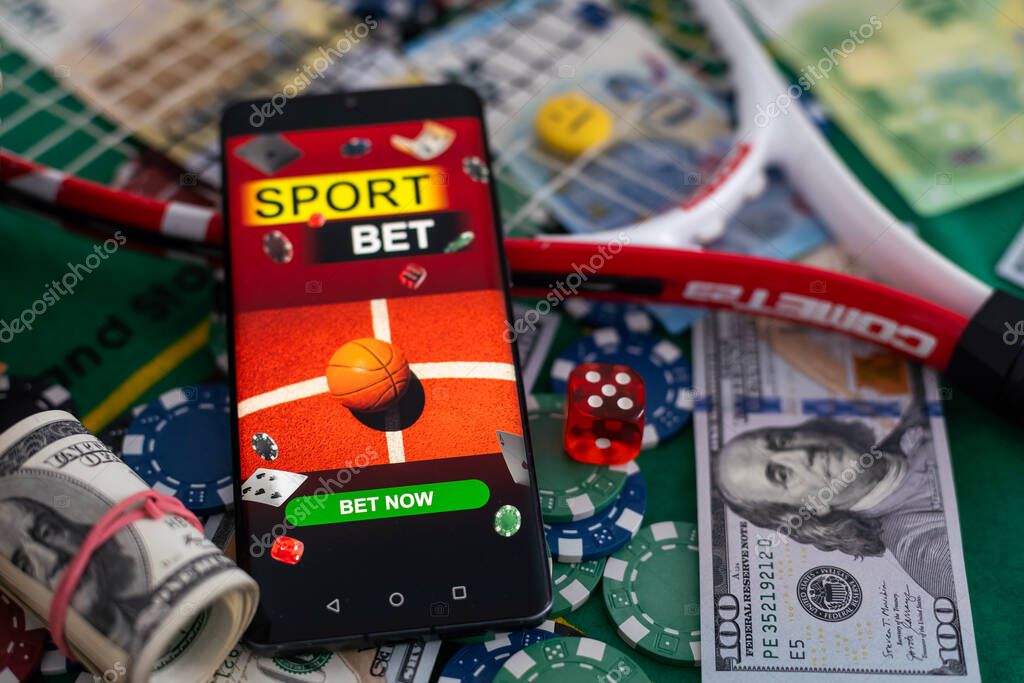 Online poker concept. Smartphone and poker chips on a green background. Poker online banner. Copy space. Vignette. Place for text. Gambling. Background. High quality photo