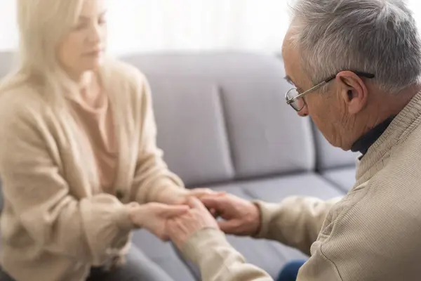 stock image Hands of the old man and a young woman. close up