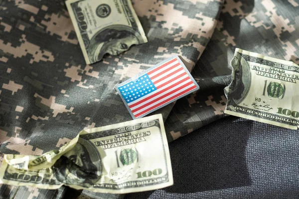 USA flag and money. Cash for VA loan from U.S. Department of Veterans Affairs. High quality photo